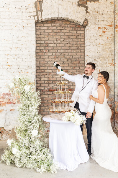 bridal party cheering for bride and groom