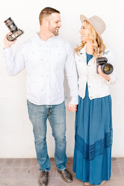 April and Jason Sapp, husband and wife photography team smiling at each other, light and airy, dallas texas