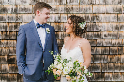 bride & groom smiling at each other