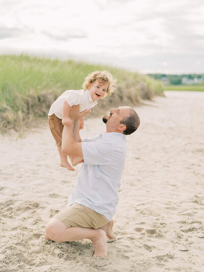 father and son playing By Carrie Pellerin