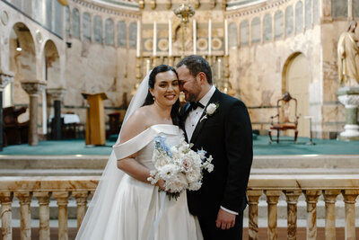 bride and groom standing in Ireland Catholic Church