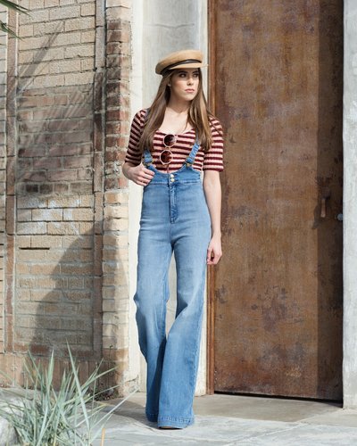 Stylish teen girl with editorial styling and posing for a photoshoot in Venice Caliofornia