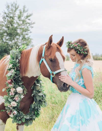 grad photo of girl with horse in a field