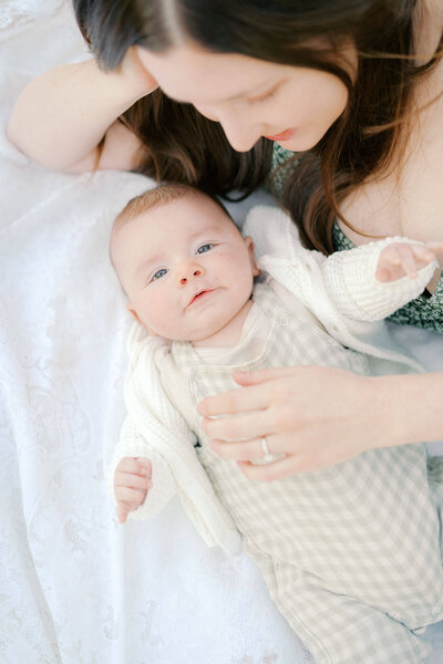 baby looking at camera during newborn photo session by portland newborn photographer samantha shannon