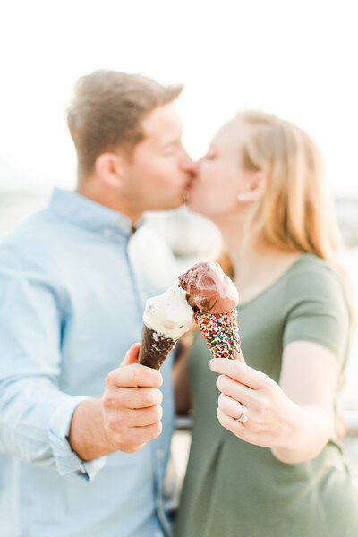 couple kisses with ice cream
