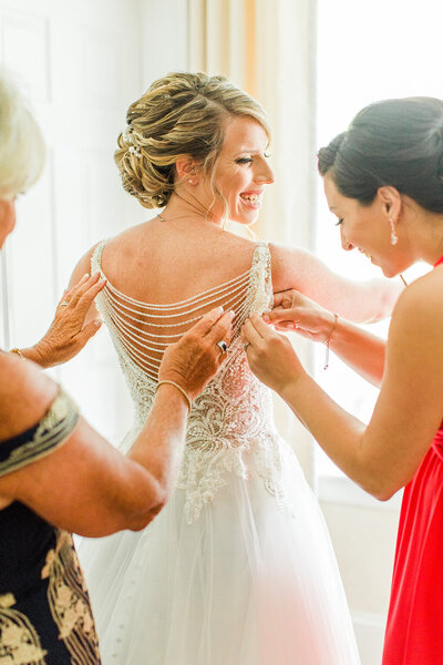 family helping bride get ready
