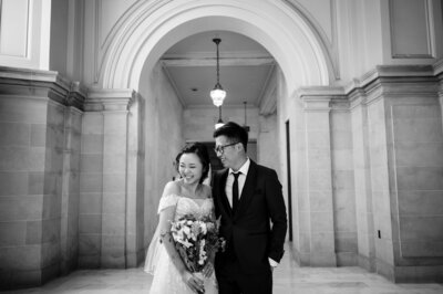 Bride and groom walk up memorial steps at their DC wedding