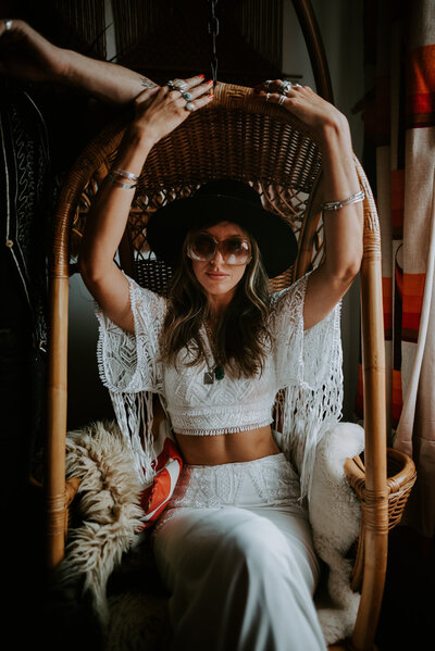 A boho 70's style bride poses for a portrait before her Manchester Wedding. 