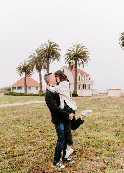 Couple kissing at Crissy Field.
