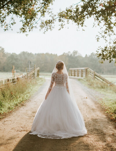 A destination bride poses elegantly on the floor of a room at Lake Como Italy.
