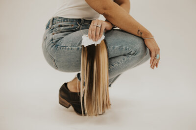 Emily holding hair extensions