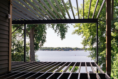 View towards a Minnesota lake from a Fortress Evolution steel deck frame without any decking or railing on it yet. 