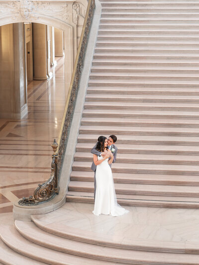 Romantic moment of bride and groom at the City Hall in SF - photo by 4Karma Studio