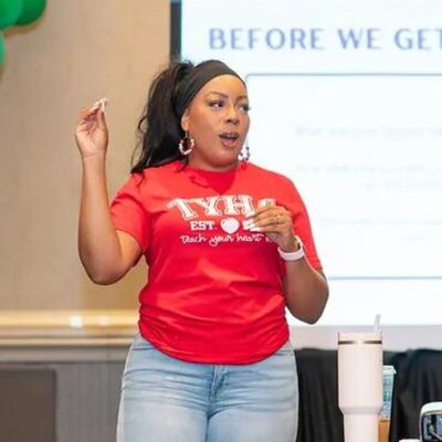 Deonna standing in front of a screen