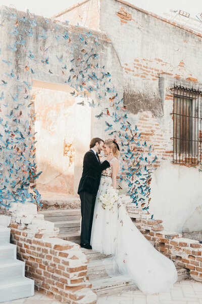 Outdoor entryway at a historic venue decorated with hundreds of hand made butterflys