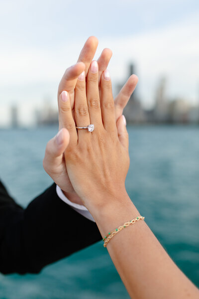 Chicago wedding photographer Melissa Stuckey holding a camera up to take a photo