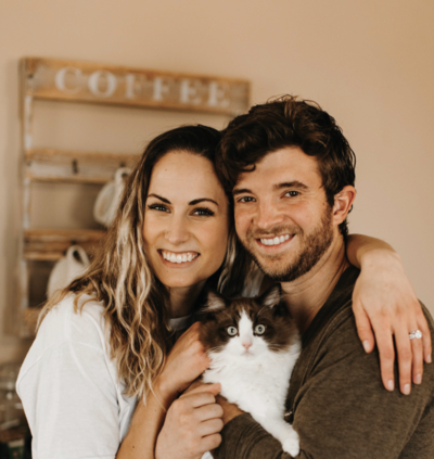 husband and wife with cat
