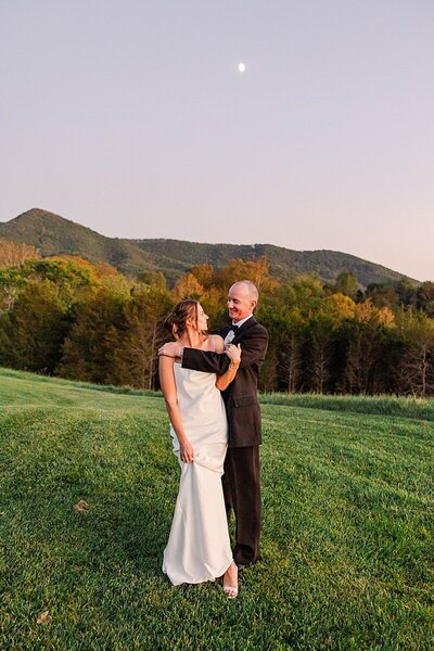 Timeless Virginia wedding at Blacksburg Country Club featuring bride and groom portraits with Blue Ridge Mountain views and elegant country club details