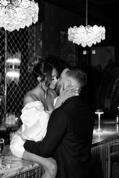 Bride & groom kissing under veil at. Philadelphia. Cricket Club