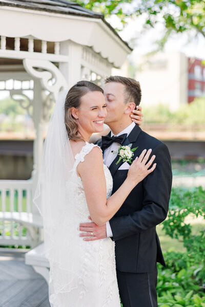 bride and groom kissing by minneapolis wedding photographer