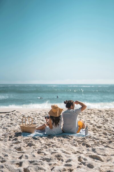 couple having picnic on beach