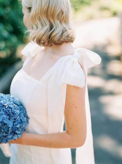 white linen bridesmaid dress with bows
