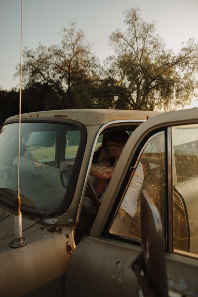 Couple in a vintage truck on farm in Los Angeles