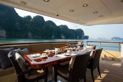 Champagne and gourmet seafood dinner served on the deck of a private yacht in Ang Thong Marine National Park.