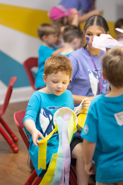 Child making crafts at Vacation Bible School at a non-denominational church in Fayetteville, NC. 