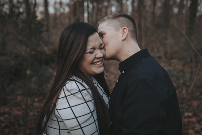 lgbtq couple laughing during their engagement photos