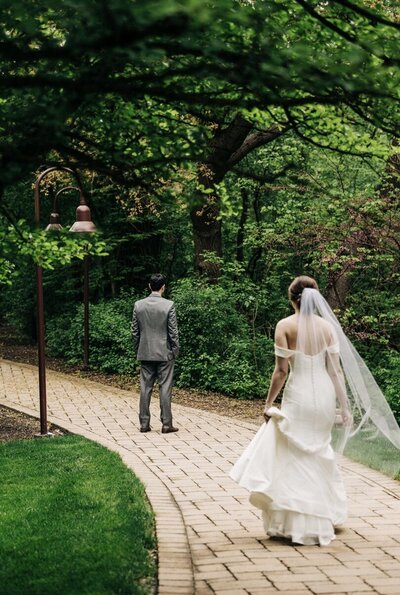 Bride and groom first look at the Hyatt Lodge Oak Brook