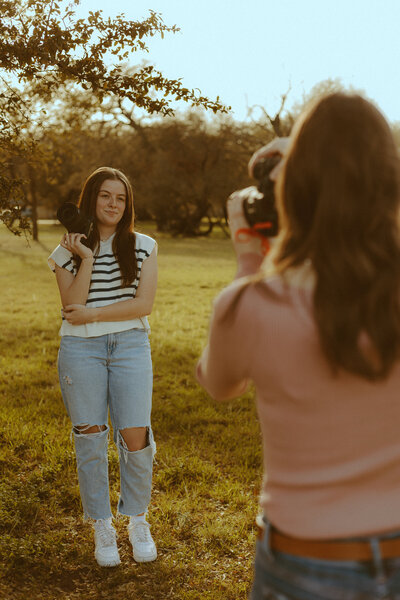 Photographer branding session by Morgan Rose Photographer in a field in Buffalo Gap, YX