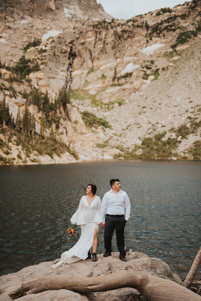 couple standing on lake side