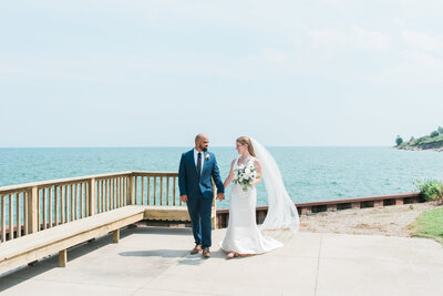Husband and Wife newlyweds in Milwaukee on Lake Michigan after their summer elopement