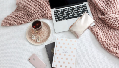 Flat lay image of laptop and other desk accessories