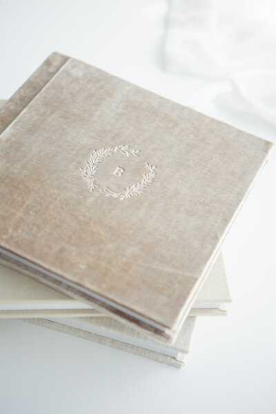 samples of fresno newborn photographer heirloom albums. linen, velvet, leather