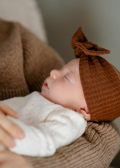 Close up photo of a newborn baby looking directly into the camera
