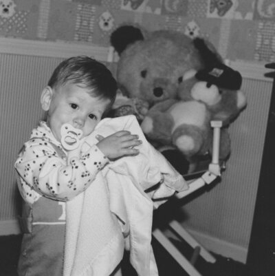 Toddler holding a blanket