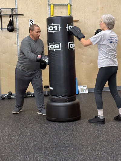 Two Parkinson's warriors exercising in non-contact boxing in a Parkinson's exercise class in the Warriors Gym In Eugene. 