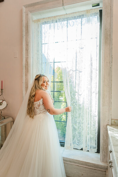 Bride taking a moment before walking down the isle.