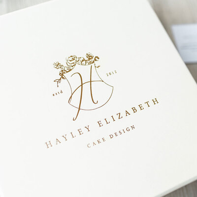 Cream gift box with floral gold foil luxury brand design logo