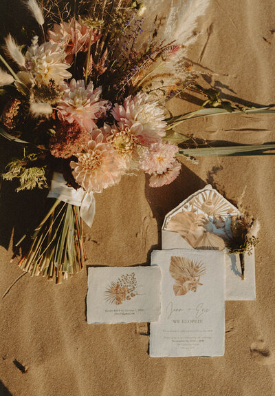 boho bouquet and wedding stationery