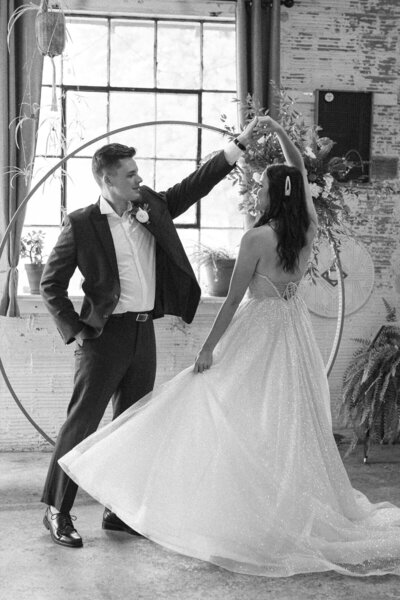 Bride and groom looking at each other as they walk up the stairs