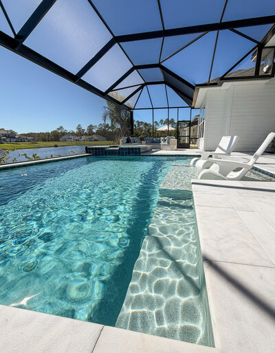 Luxury North Florida custom backyard with pool and outdoor kitchen by Southern Outdoor Spaces