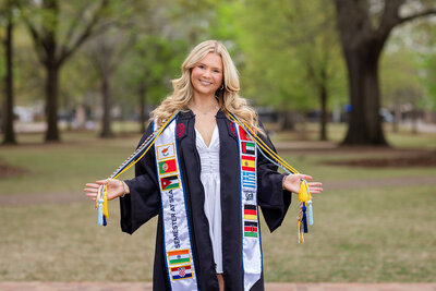 A University of South Carolina student taking his senior portraits on campus