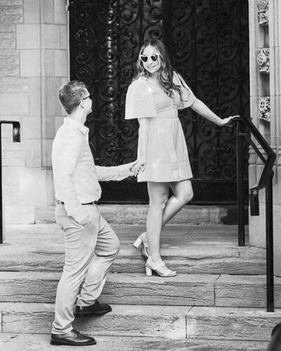 Couple holding hand looking at each other on stairs