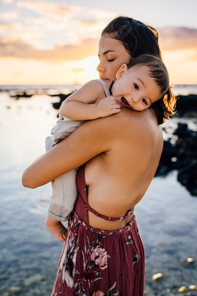 mom and son at sunset in big island hawaii