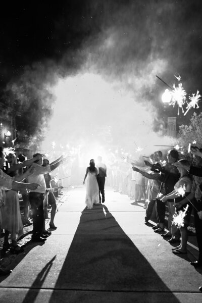 "Bride and groom sparkler exit on the Riverwalk in historic downtown Wilmington NC"