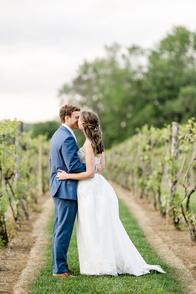 Bride and Groom standing in prom pose on their wedding day at Gervasi Vineyard photographed by akron ohio wedding photographer