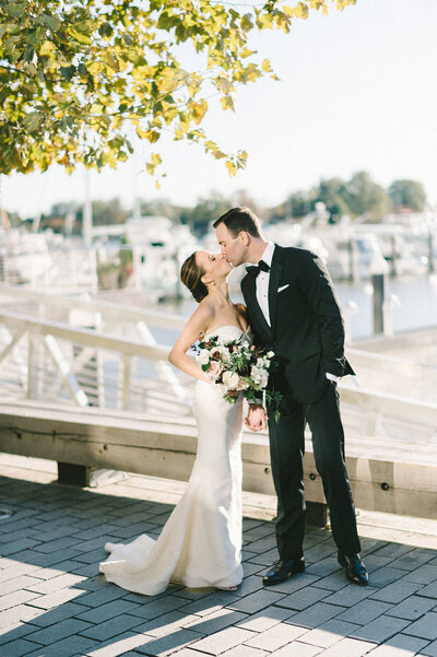 bride-groom-kissing-intercontinental-wharf-dc-liz-fogarty